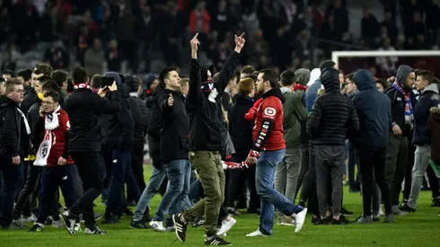 Ten in custody after Lille fans pitch invasion