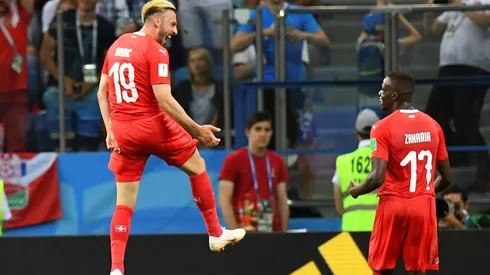 Swiss through to last 16 but lose captain Lichtsteiner