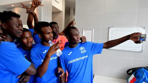 Italian football legends take on refugee team in match for solidarity