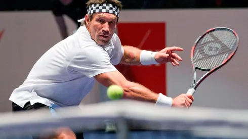 Real men don't play football, says tennis great Cash