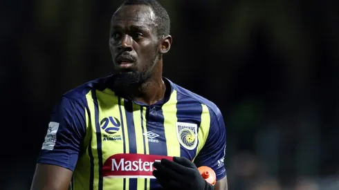 Bolt makes football debut, tires quickly