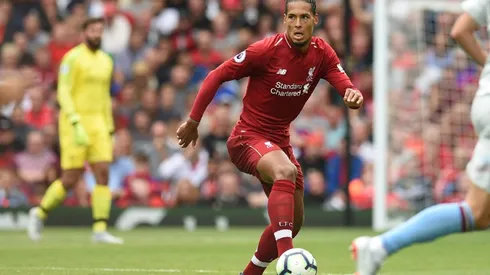Van Dijk eyes silverware as Liverpool chase history