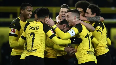 Dortmund edge Bremen to stay unbeaten and increase lead