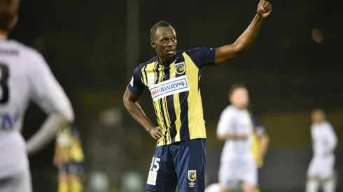 Bolt hanging up boots on football dream