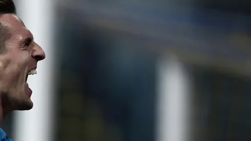 Napoli's Milik defiant over title chances after Parma double