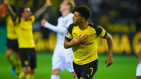 Dortmund withstand late Leverkusen fightback to go three points clear