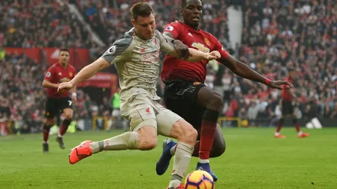 Liverpool go top after stalemate at injury-hit United