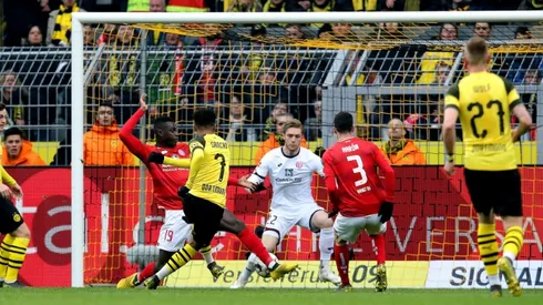 Sancho and Buerki send Dortmund top with nerve-jangling win over Mainz