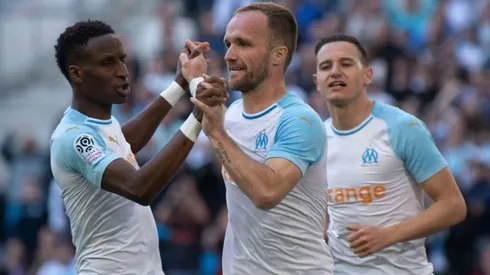 Marseille's Germain celebrates scoring a goal with Bouna and Thauvin