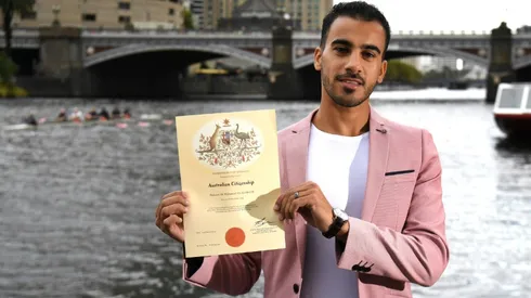 Refugee footballer votes after getting Australian citizenship
