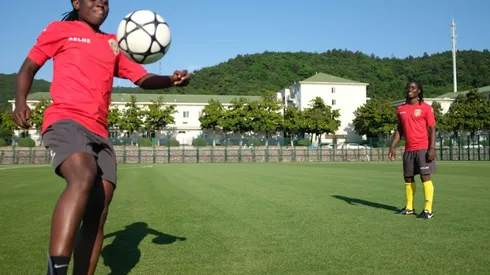 African 'twin sisters' tackle Chinese football together