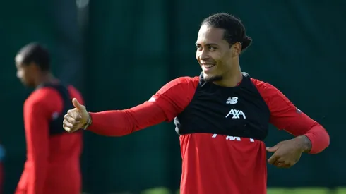 Van Dijk says too early for Liverpool title talk