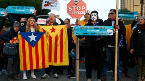 Protestors hold up banners at Camp Nou ahead of crunch Clasico