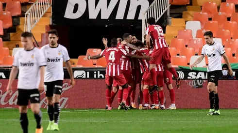 Atletico beat Valencia to move level with leaders Sociedad