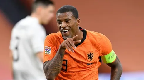 Wijnaldum fires Dutch top to give De Boer first win