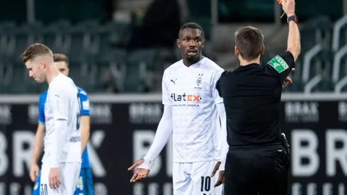 Gladbach forward Thuram sent off after spitting in opponent's face