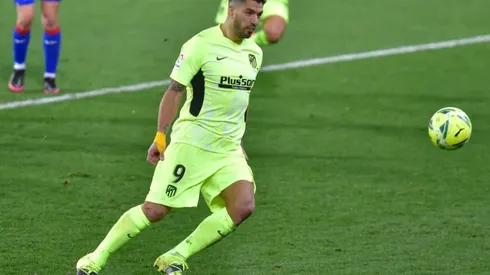 Suarez double fires Atletico seven points clear