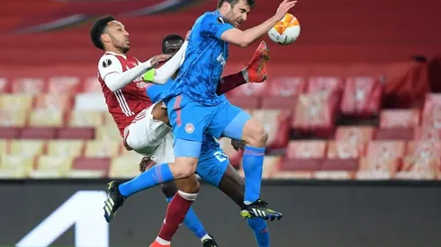 Arsenal stagger into Europa League quarters as Spurs collapse