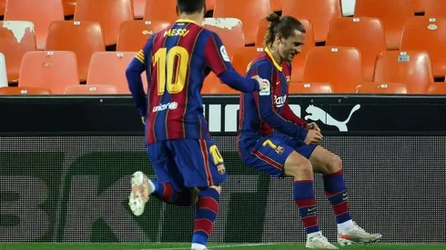 Messi double leads Barca to nail-biting win over Valencia