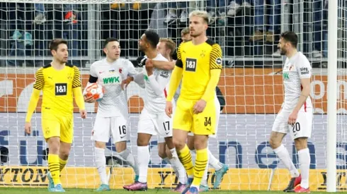 Dortmund held at Augbsurg to leave Bayern eight points clear