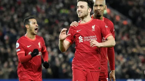 Jota double keeps Liverpool in title hunt, 10-man Arsenal win at Wolves