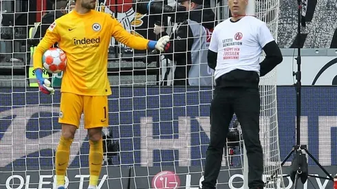 Protestors tie themselves to goal posts and halt Bundesliga match