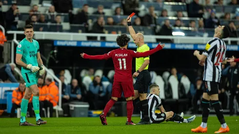 Liverpool beat ten man Newcastle to keep top four hopes alive