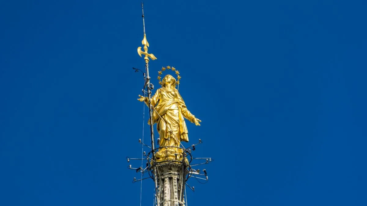 Statue of the Virgin Mary on top of the Milan Cathedral (Duomo di Milano) in Italy