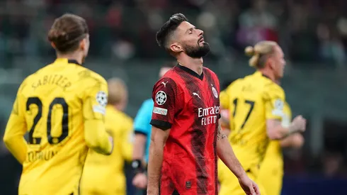 Dortmund into Champions League knockouts with win at Milan