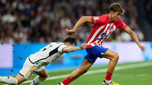 Atletico hold Real in Madrid derby with last gasp Llorente header