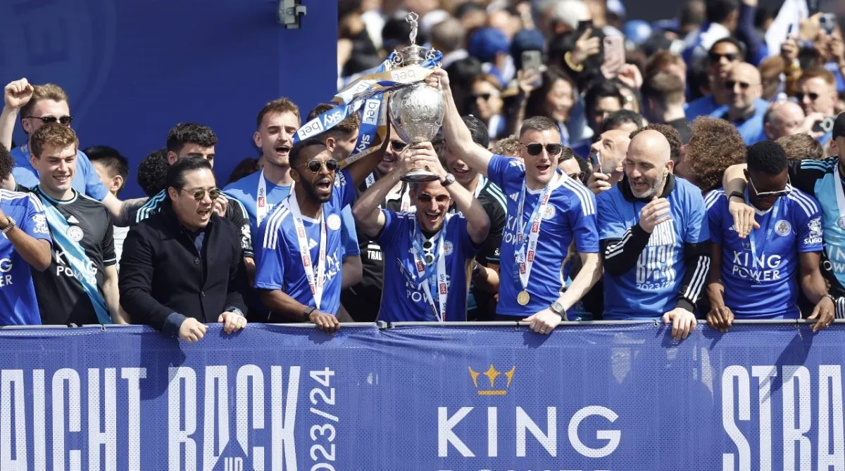 Jamie Vardy celebrating promotion with his Leicester City teammates