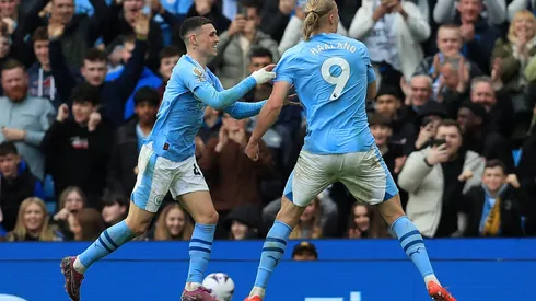 Haaland nets four as Man City keep pace in title race