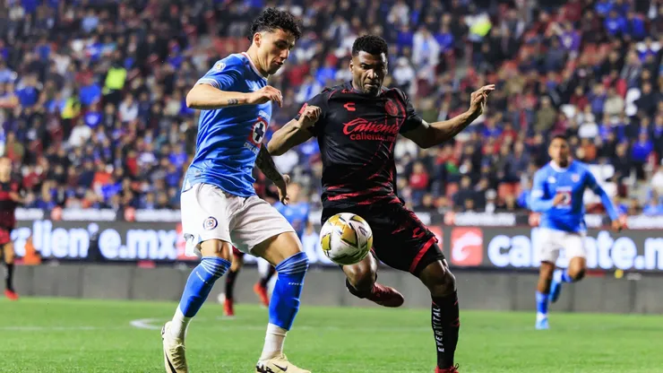 Jorge Sanchez (L) of Cruz Azul fights for the ball with Jose Zuniga (R) of Tijuana.