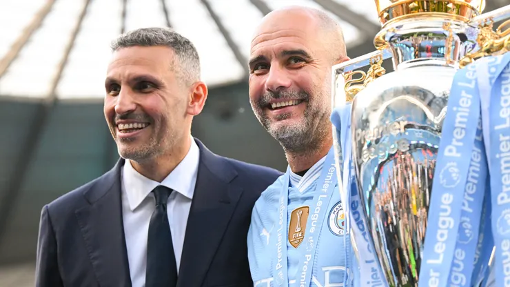 Khaldoon Al Mubarak, Chairman of Manchester City, and Pep Guardiola, Manager of Manchester City, poses for a photo with the Premier League title trophy following the team's victory in the Premier League match between Manchester City and West Ham United at Etihad Stadium on May 19, 2024 in Manchester, England.