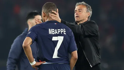 Kylian Mbappe of Paris Saint-Germain is consoled by Luis Enrique,
