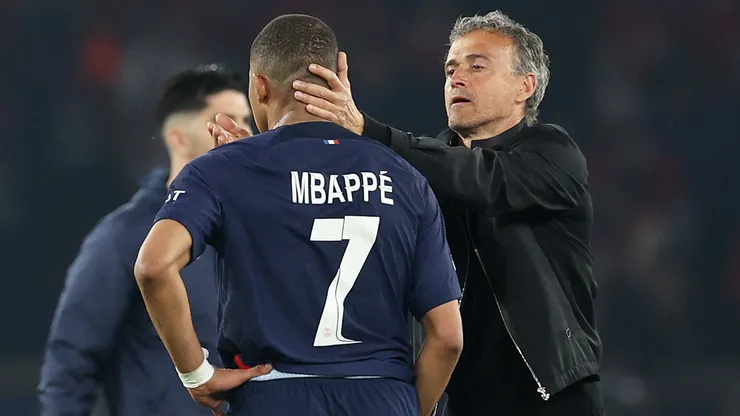 Kylian Mbappe of Paris Saint-Germain is consoled by Luis Enrique,