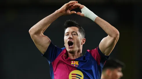 Robert Lewandowski of FC Barcelona celebrates scoring his team's first goal from a penalty during the UEFA Champions League 2024/25 League Phase MD5 match between FC Barcelona and Stade Brestois 29 at Estadi Olimpic Lluis Companys on November 26, 2024 in Barcelona, Spain.