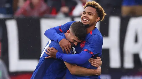 Weston McKennie #8 of the United States is and Christian Pulisic #10