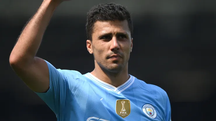 Rodri of Manchester City celebrates to fans following the Premier League match between Fulham FC and Manchester City at Craven Cottage on May 11, 2024 in London, England.
