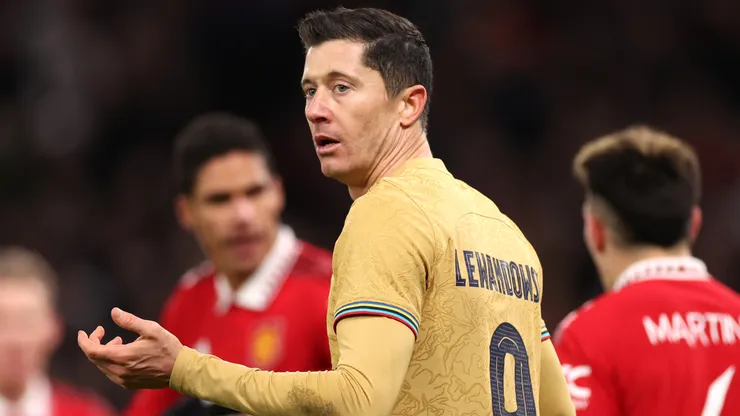Robert Lewandowski of FC Barcelona looks dejected following the team's defeat in the UEFA Europa League knockout round play-off leg two match between Manchester United and FC Barcelona at Old Trafford on February 23, 2023 in Manchester, England.