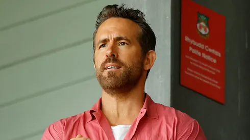 Co-owner of Wrexham Football Club Ryan Reynolds removes his jacket during the Sky Bet League Two match between Wrexham and Milton Keynes Dons at Stok Cae Ras stadium on August 05, 2023 in Wrexham, Wales.