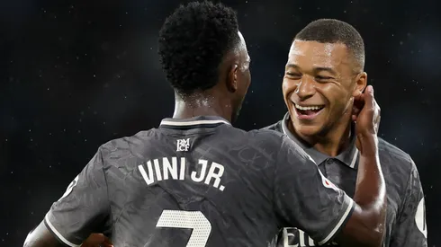 Kylian Mbappe of Real Madrid celebrates scoring his team's first goal with teammate Vinicius Junior during the LaLiga match between RC Celta de Vigo and Real Madrid CF at Estadio Balaidos on October 19, 2024 in Vigo, Spain.