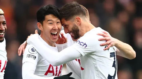 Son Heung-min of Tottenham Hotspur celebrates scoring his first goal with Rodrigo Bentancur and Emerson Royal during the Premier League match between Aston Villa and Tottenham Hotspur at Villa Park on April 9, 2022 in Birmingham, United Kingdom.