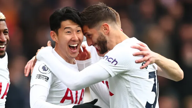 Son Heung-min of Tottenham Hotspur celebrates scoring his first goal with Rodrigo Bentancur and Emerson Royal during the Premier League match between Aston Villa and Tottenham Hotspur at Villa Park on April 9, 2022 in Birmingham, United Kingdom.