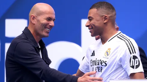 Real Madrid new signing, Kylian Mbappe (R) is greeted by former Real Madrid player and coach, Zinedine Zidane as he is unveiled at Estadio Santiago Bernabeu on July 16, 2024 in Madrid, Spain.