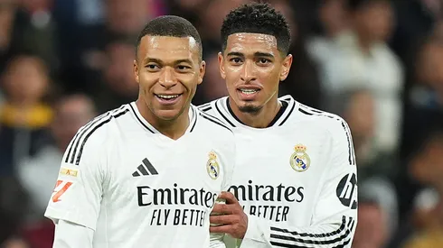 ude Bellingham of Real Madrid interacts with Kylian Mbappe of Real Madrid after he scored a goal which was ruled out for offside following a VAR review during the LaLiga match between Real Madrid CF and FC Barcelona at Estadio Santiago Bernabeu on October 26, 2024 in Madrid, Spain.