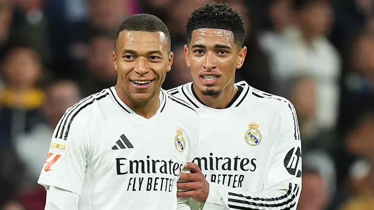 ude Bellingham of Real Madrid interacts with Kylian Mbappe of Real Madrid after he scored a goal which was ruled out for offside following a VAR review during the LaLiga match between Real Madrid CF and FC Barcelona at Estadio Santiago Bernabeu on October 26, 2024 in Madrid, Spain.