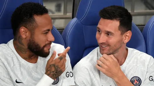 Neymar Jr and Lionel Messi of Paris Saint-Germain talk on the bench prior to the preseason friendly between Paris Saint-Germain and Urawa Red Diamonds at Saitama Stadium on July 23, 2022 in Saitama, Japan.