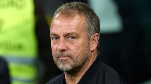 Hansi Flick, Head Coach of FC Barcelona, looks on prior to the LaLiga match between Real Madrid CF and FC Barcelona at Estadio Santiago Bernabeu on October 26, 2024 in Madrid, Spain.