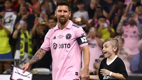 Lionel Messi #10 of Inter Miami walks out with a young fan prior to the Leagues Cup 2023 final match between Inter Miami CF and Nashville SC at GEODIS Park on August 19, 2023 in Nashville, Tennessee.